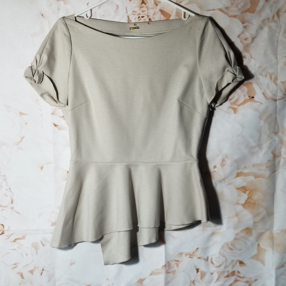 Elie Tahari beige Gabby peplum wool blouse.